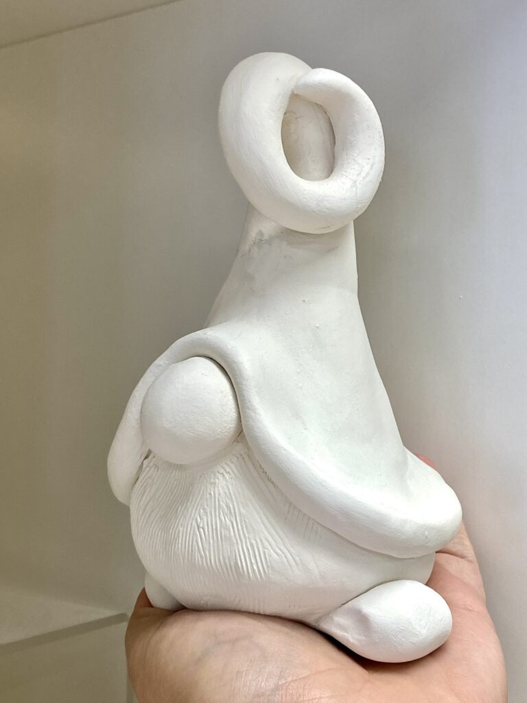 creature with big hat, no eyes, and big noes, and shoes