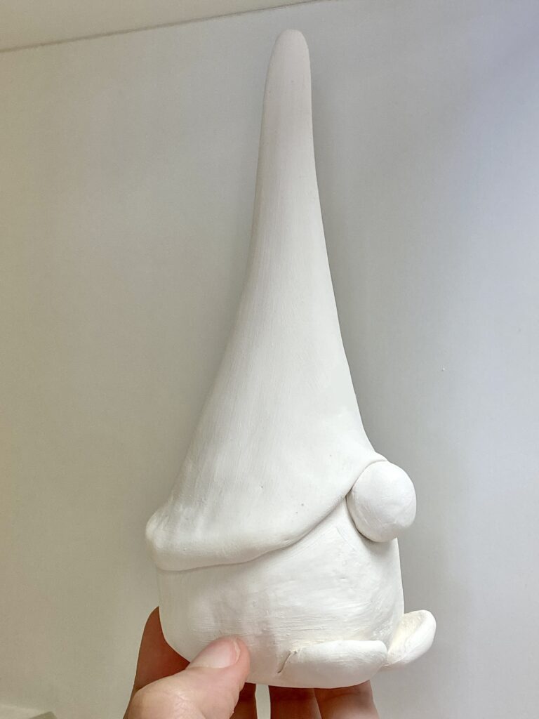 creature with big hat, no eyes, and big noes, and shoes