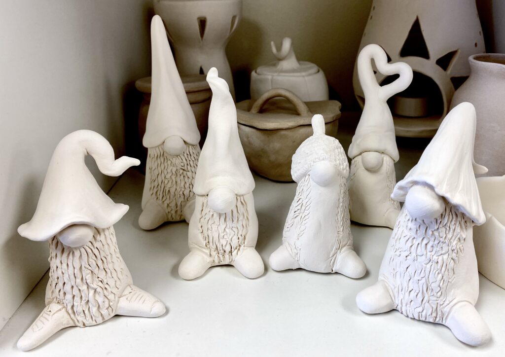 creature with big hat, no eyes, and big noes, and shoes