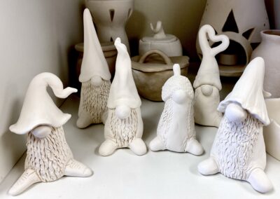 creature with big hat, no eyes, and big noes, and shoes