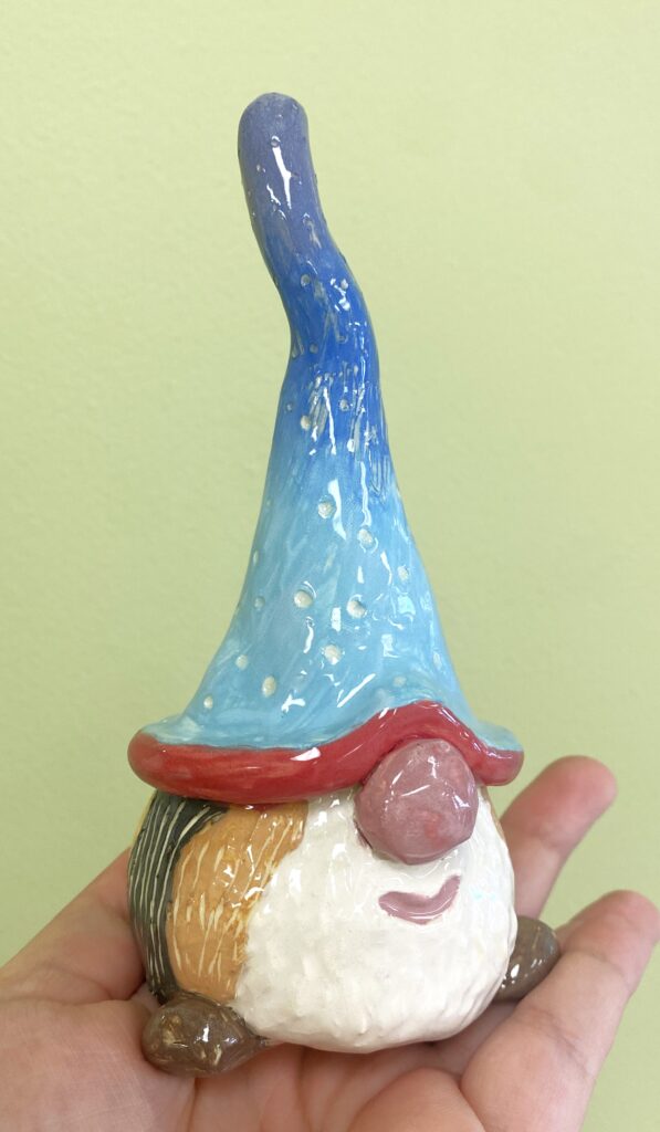 gnome out of clay painted with multiple colors