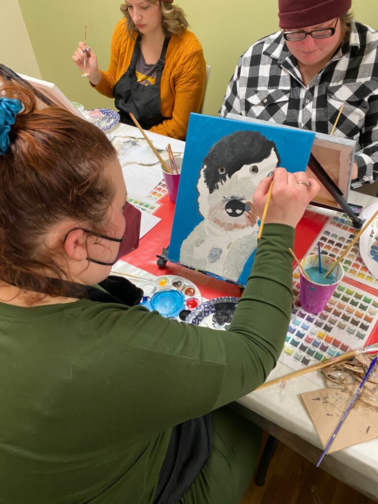 person painting their dog