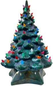 antique christmas tree painted green with colorful light and bird inserts 
